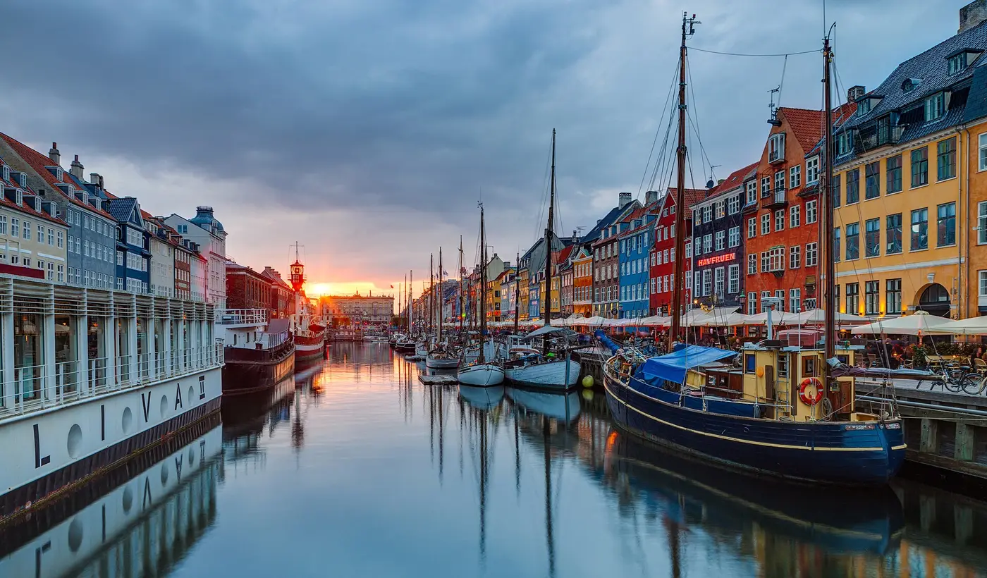Nyhavn harbour at sunset in Copenhagen, Denmark