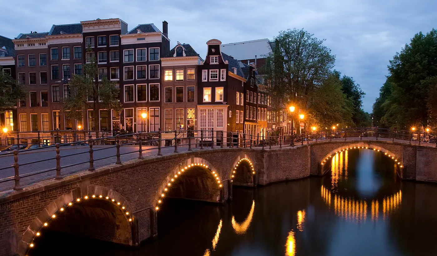Canal bridge at dusk in Amsterdam, Netherlands