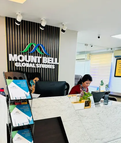 Reception desk under the Mount Bell Global Studies sign